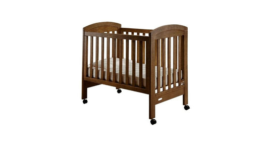 Baby cot with Australian made custom sheets