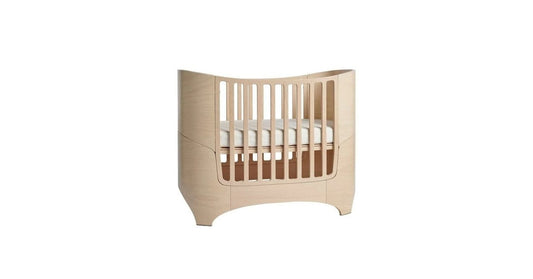 Oval baby cot with custom made sheets